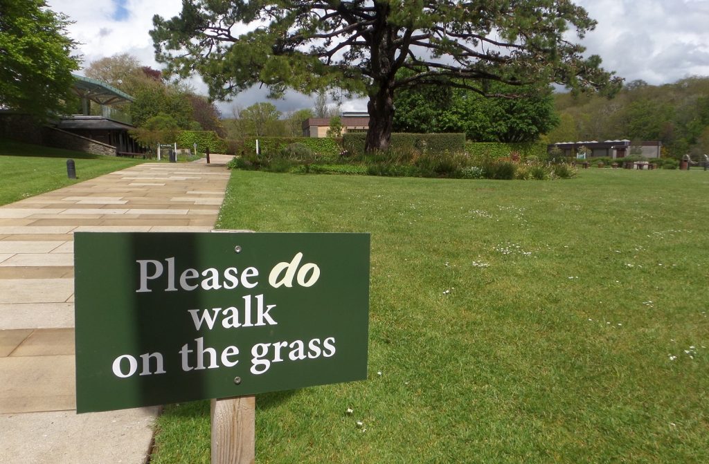 a picture of some grass with a sign reading please do walk on the grass